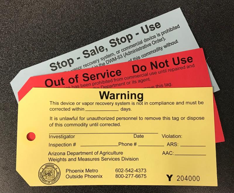 Tags used by WMSD including a yellow warning tag, a red out of service tag and a gray stop sale and stop use tag